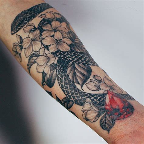 snake upper arm tattoo